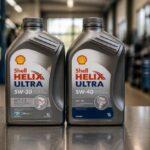 Dwie butelki oleju silnikowego Shell Helix Ultra 5W-30 na warsztatowym blacie