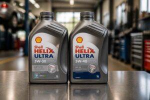 Dwie butelki oleju silnikowego Shell Helix Ultra 5W-30 na warsztatowym blacie