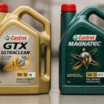 Dwa kanistry oleju silnikowego Castrol GTX Ultraclean i Magnatec w złotym i zielonym opakowaniu
