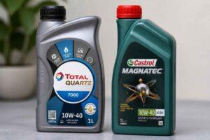 Dwie butelki oleju silnikowego Total Quartz 7000 i Castrol Magnatec 10W-40 na stole